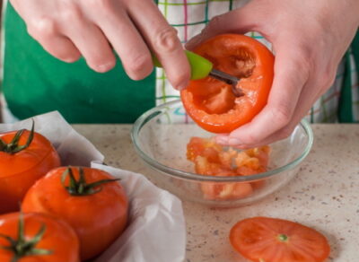 Scooping out tomatoes