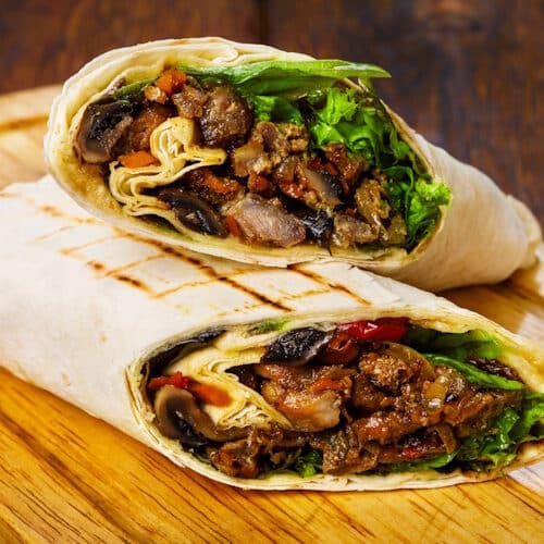Gluten free burritos with refried beans and vegetables.